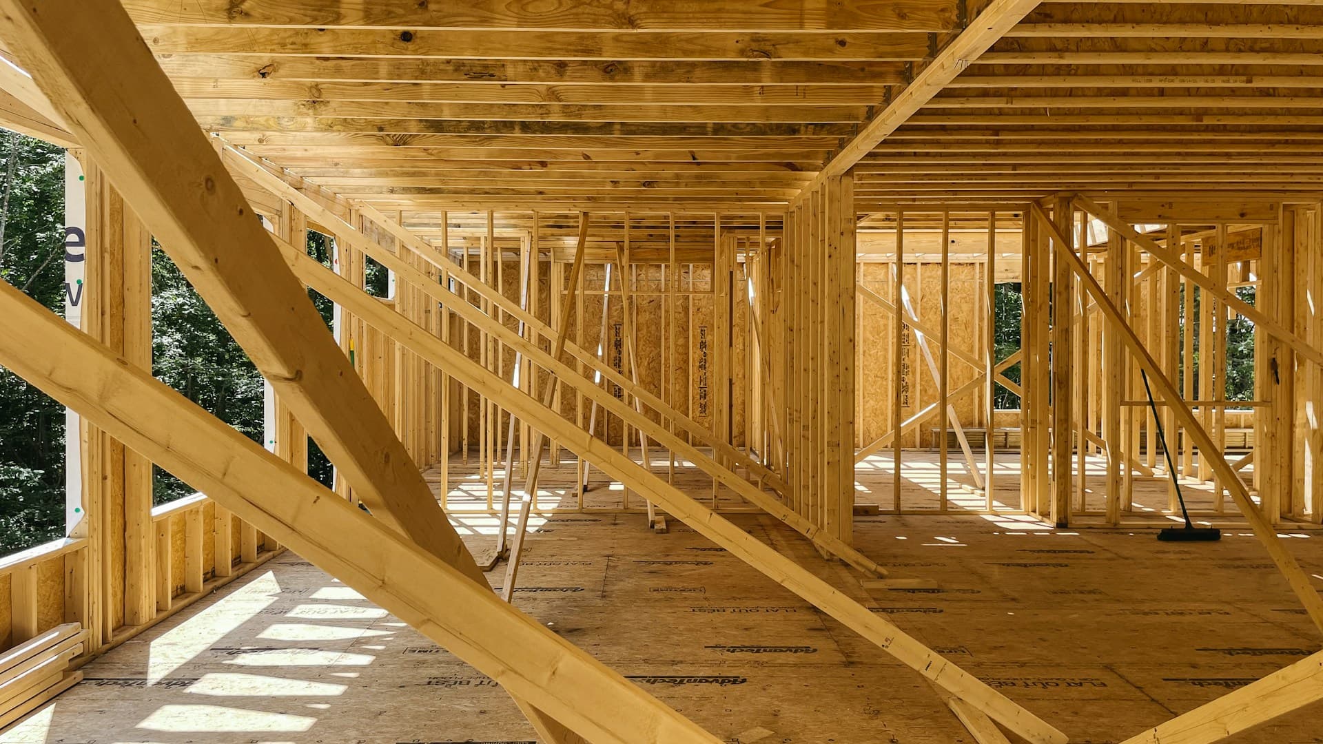 Interior timber stud wall framing and roof structure of a house under construction